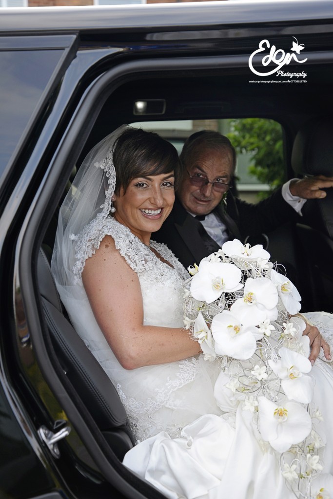 Bride in car with Fathers
